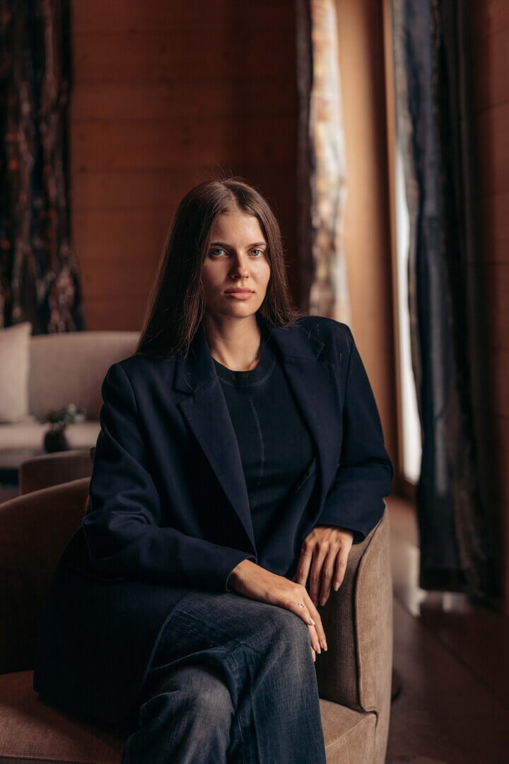 Anastasija Jovicic seated in a timber interior